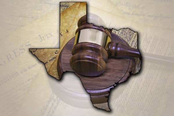The shape of Texas with a gavel shown in the middle of it | Hammerle Finley Law Firm