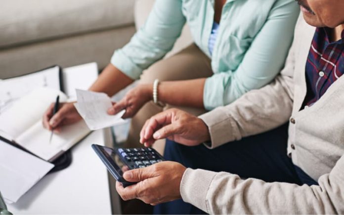 Resources for Seniors during COVID-19 A lawyer talking to her senior client on Estate Planning through the COVID-19 pandemic.