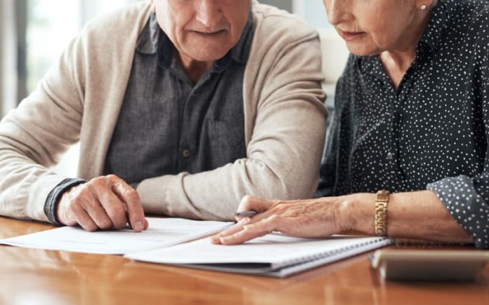 Elderly couple reviewing their trusts