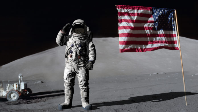 Astronaut on moon with American flag