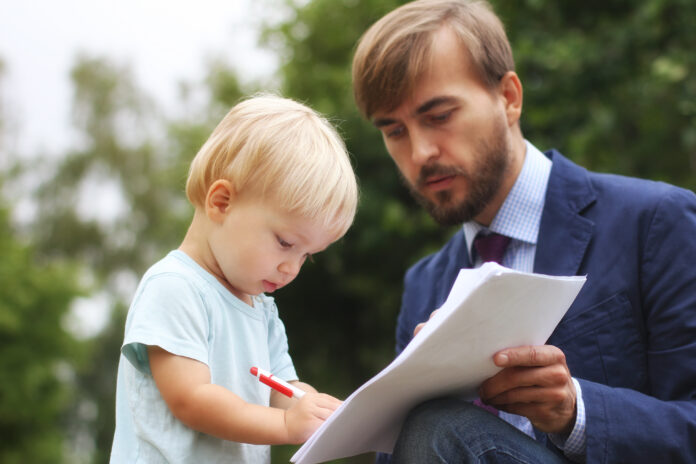 father gives documents to his son