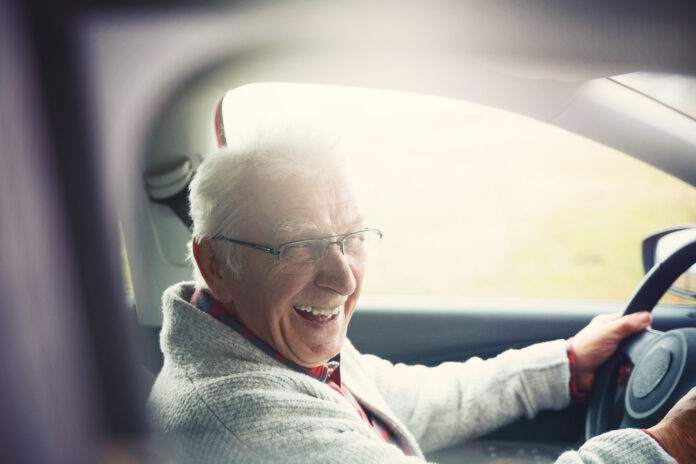 Elderly gentleman driving a car