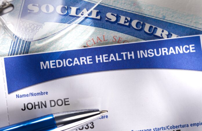 Social security and Medicare cards stacked on top of each other