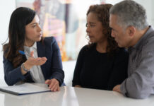 A couple in a meeting with their financial advisor.