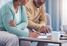 Senior couple, documents and sign contracts.