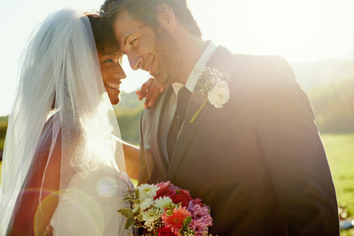 Shot of a newlywed couple standing close together after the wedding ceremony