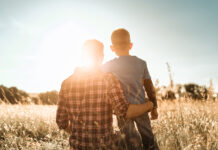 Father and son in a natural setting.