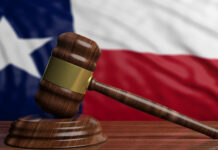 Judge or auction gavel on Texas US America flag background. 3d illustration