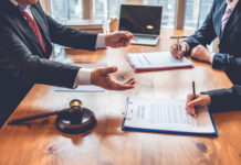 business people and lawyers discussing contract papers.Legal planning. Concepts of law, advice, legal services