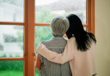 A young Asian woman spending time at home with her retired mother during weekend.